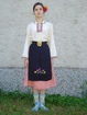 Mомичешка носия от началото на 20 век, село Писарево, община Горна Оряховица. Състои се от фуста, празнична престилка , риза и чорапи.